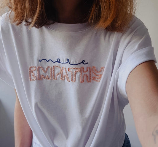 Hand Embroidered “More Empathy” T-Shirt – 100% Cotton White Knot Tee, Positive Slogan Top, Lightweight Summer Shirt