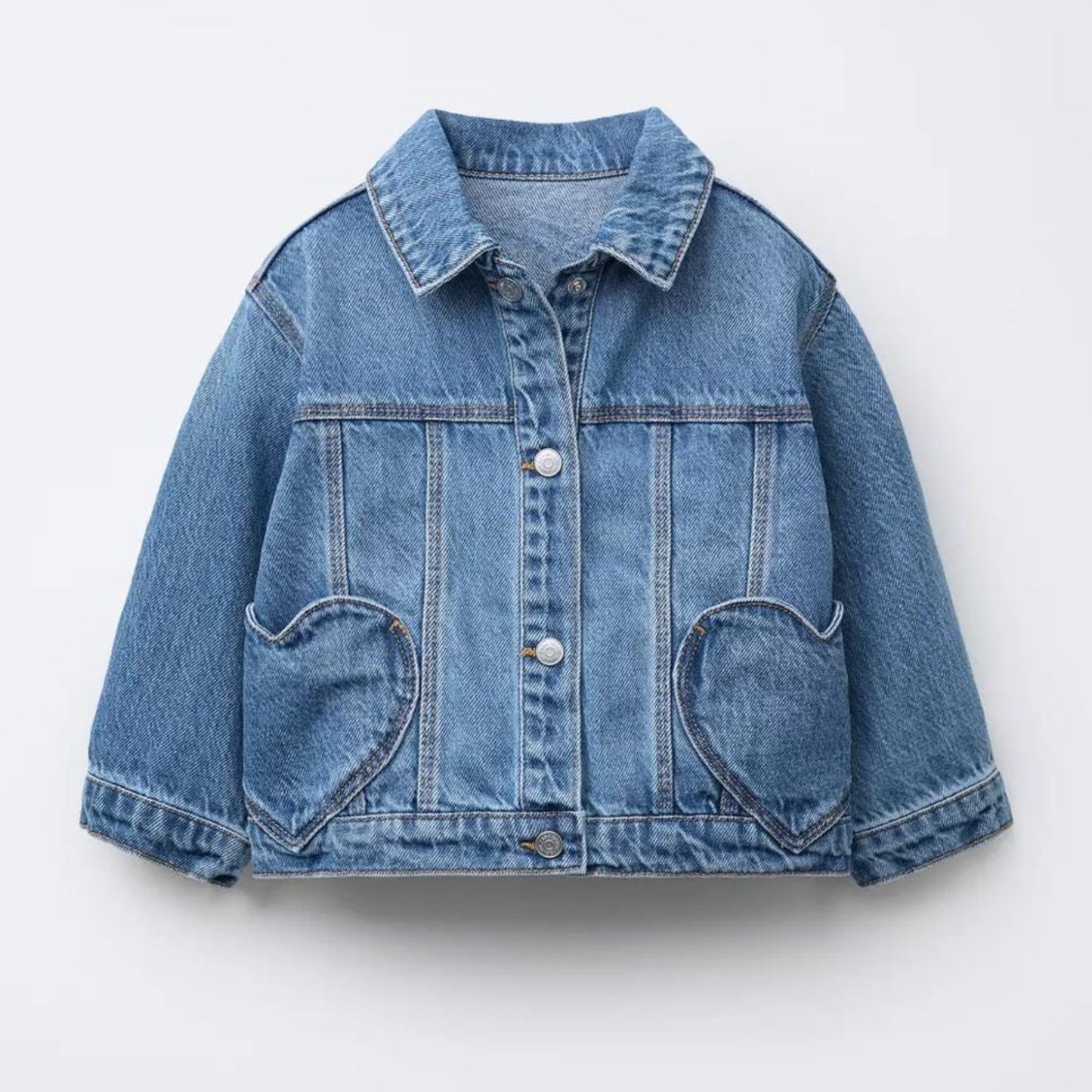 Blue denim jacket on a light gray background