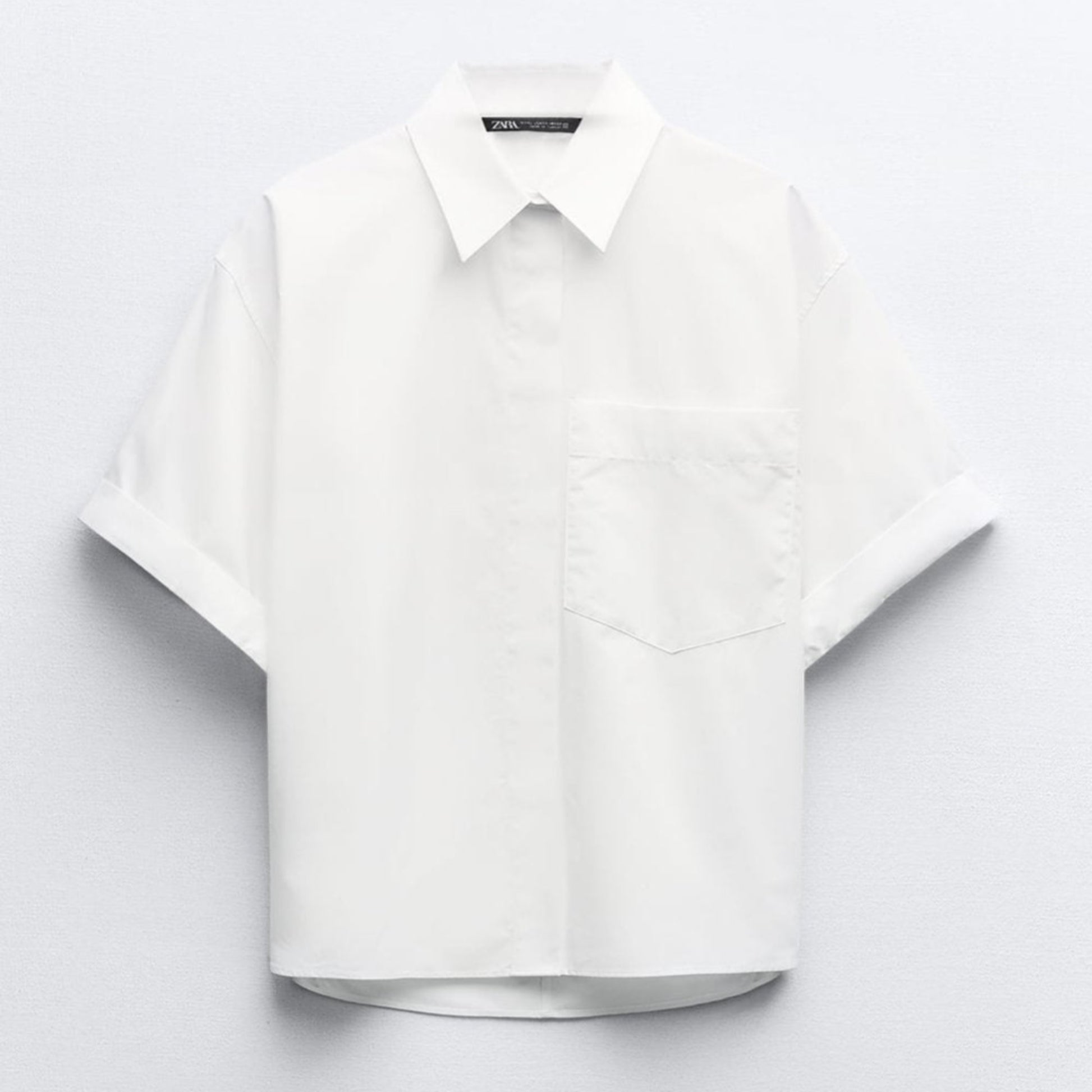 White shirt on a light gray background