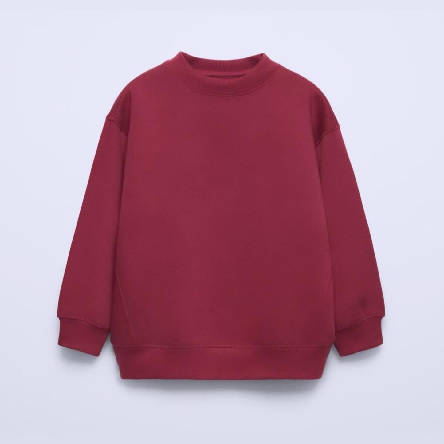 Red sweatshirt on a light purple background