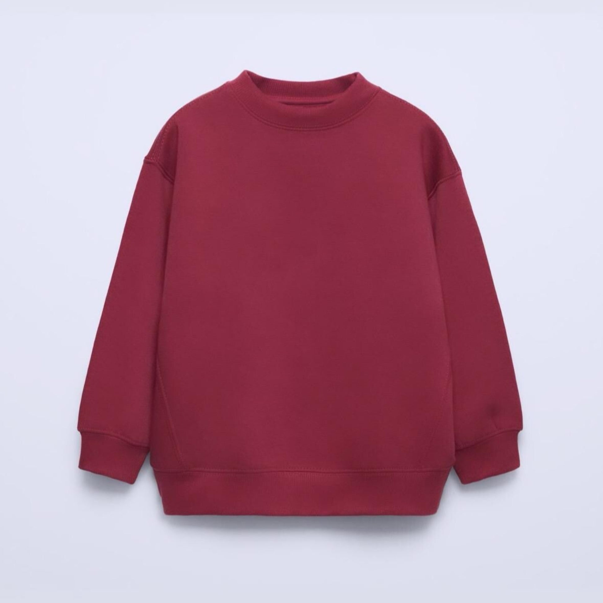 Red sweatshirt on a light purple background