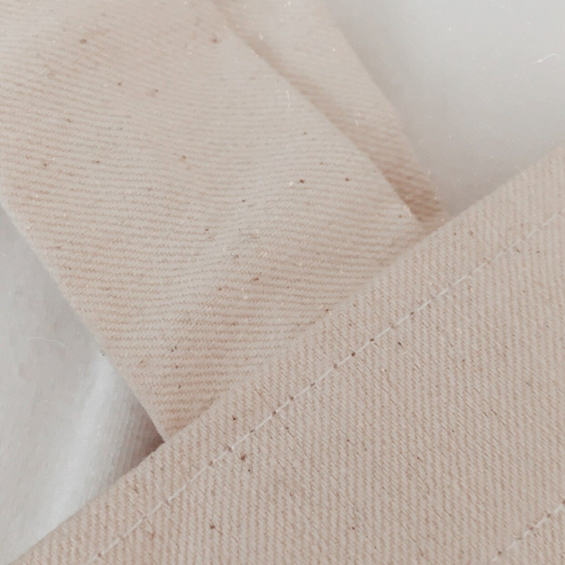 Close-up of beige fabric texture