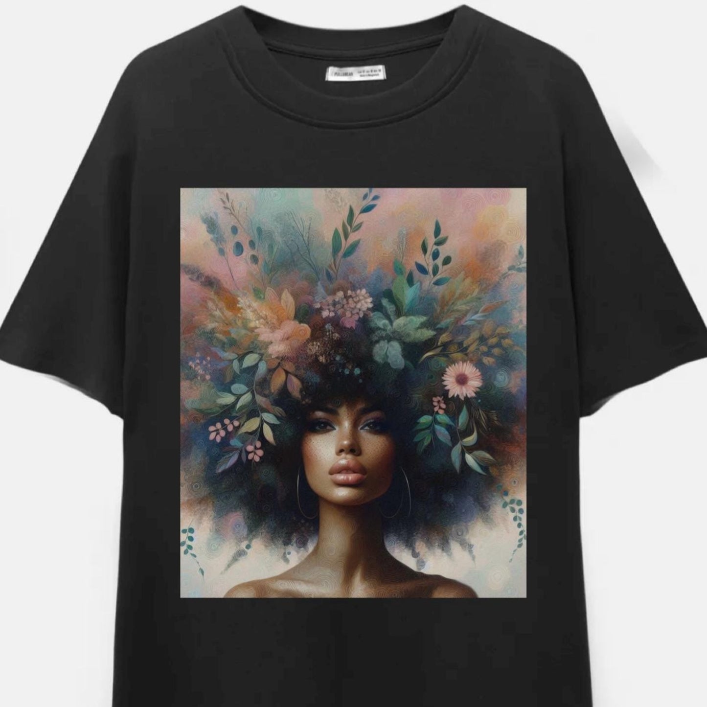 Black t-shirt with a colorful graphic of a woman with flowers in her hair on a white background